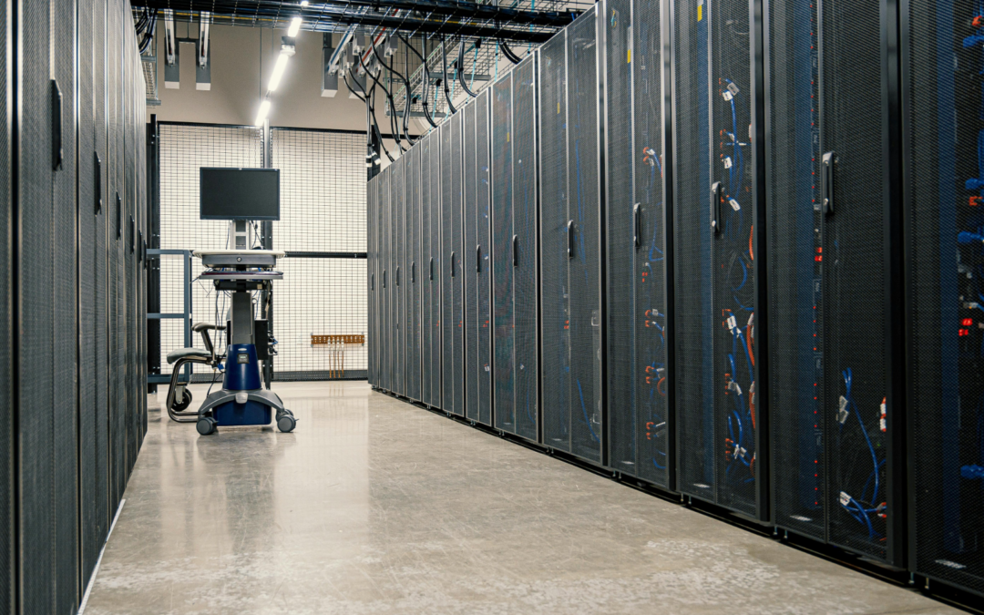 A data centre with large servers either side.